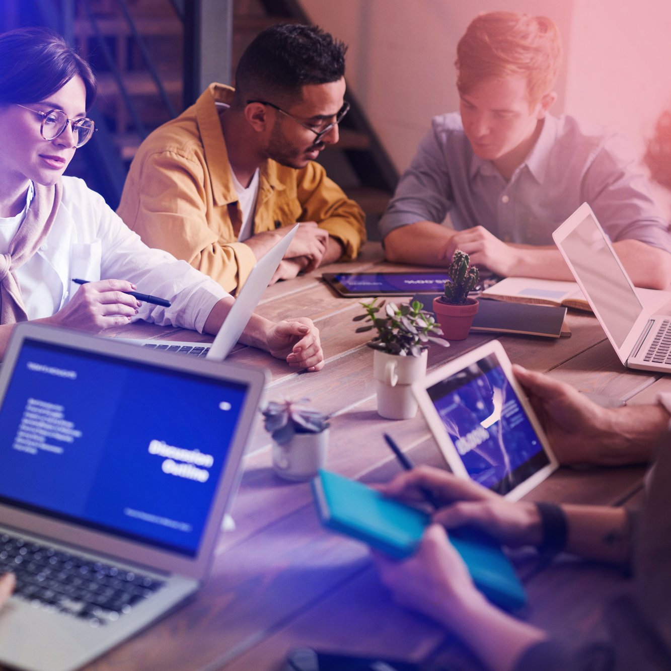 Group workshop analyzing audio brand identity using laptops and insights tools.