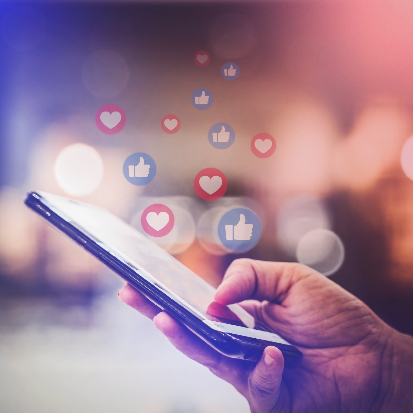 Hand holding phone with floating social icons to illustrate user delight.